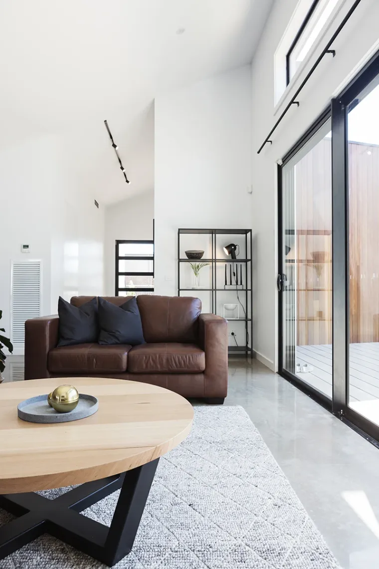 A beautifully clean and organized living room with modern decor.